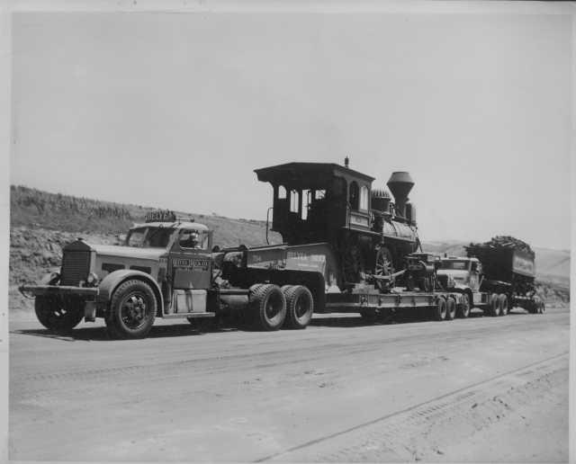 1940s Trucks Hauling Steam Train & Wood Car Press Photo 0002 - Belyea Truck Co