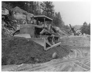 1950s Sterling Dump Truck with International Dozer Foreground Press Photo 0036