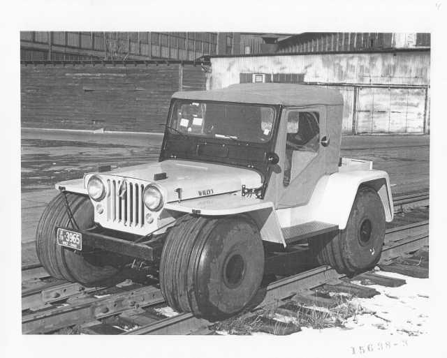 1957 Willys Jeep With Wide Tires on Railroad Tracks Press Photo 0007